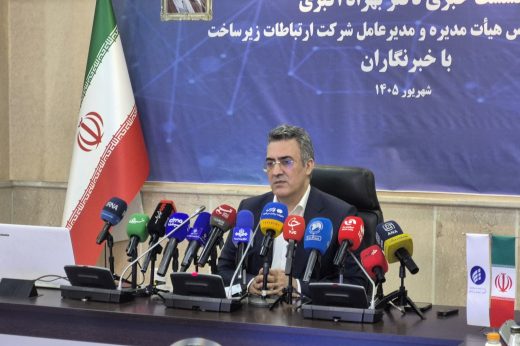 Behzad Akbari seated behind microphones at a press conference. Iran internet filtering