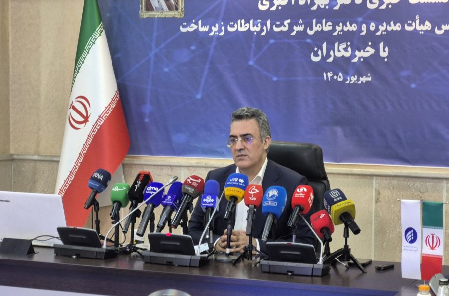 Behzad Akbari seated behind microphones at a press conference. Iran internet filtering