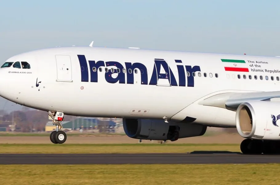 Front section of a white aircraft with Iran Air lettering and an Iranian flag.