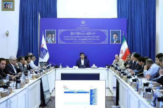 Officials seated around a conference table at a National Information Network steering council meeting.