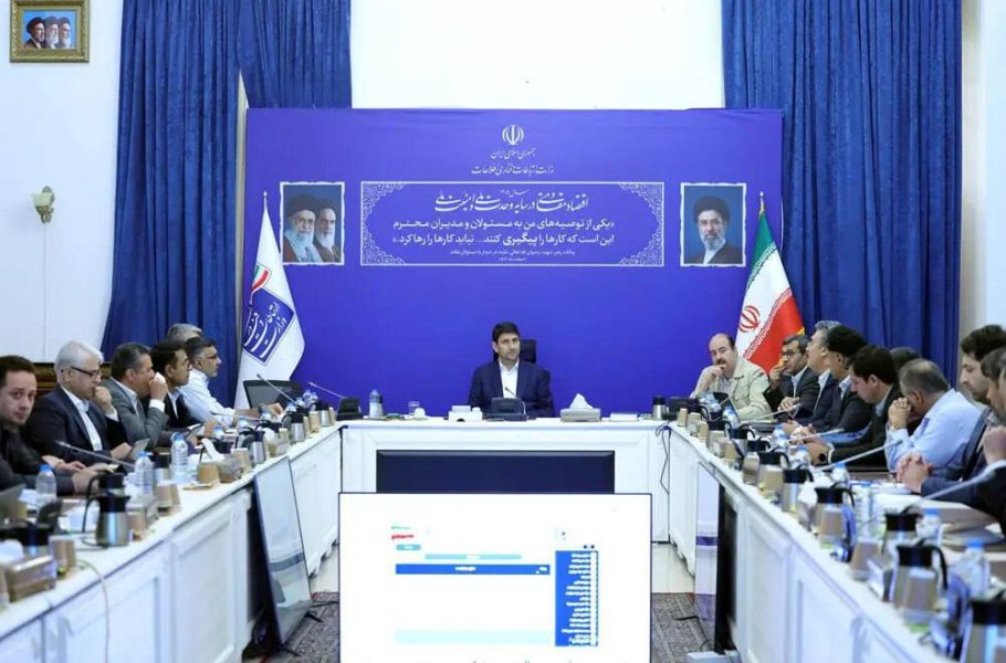 Officials seated around a conference table at a National Information Network steering council meeting.