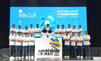 Members of Iran’s national skills team pose behind a WorldSkills Iran sign.