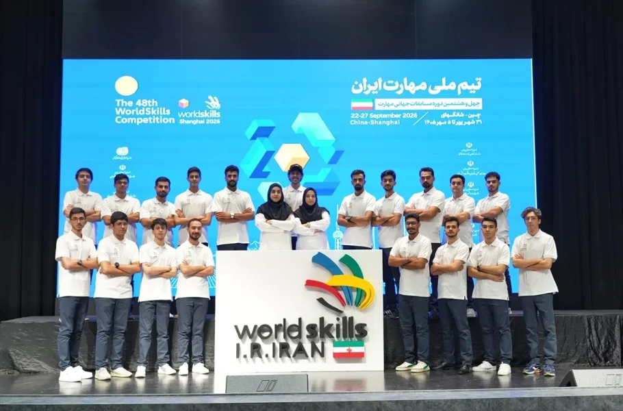 Members of Iran’s national skills team pose behind a WorldSkills Iran sign.