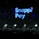 Five seated speakers take part in a panel in front of a blue SnappPay backdrop.