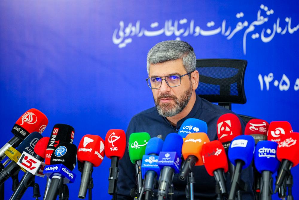 Hamid Fattahi seated behind microphones at an Oct. 18 press conference.