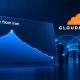 A descending blue illustrative traffic line beside Cloudflare branding and network-server graphics.