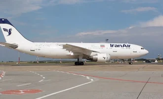An Iran Air passenger aircraft on an airport apron.