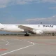 An Iran Air passenger aircraft on an airport apron.