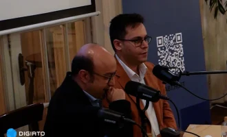 Two speakers seated at microphones beside a RabtHost banner.